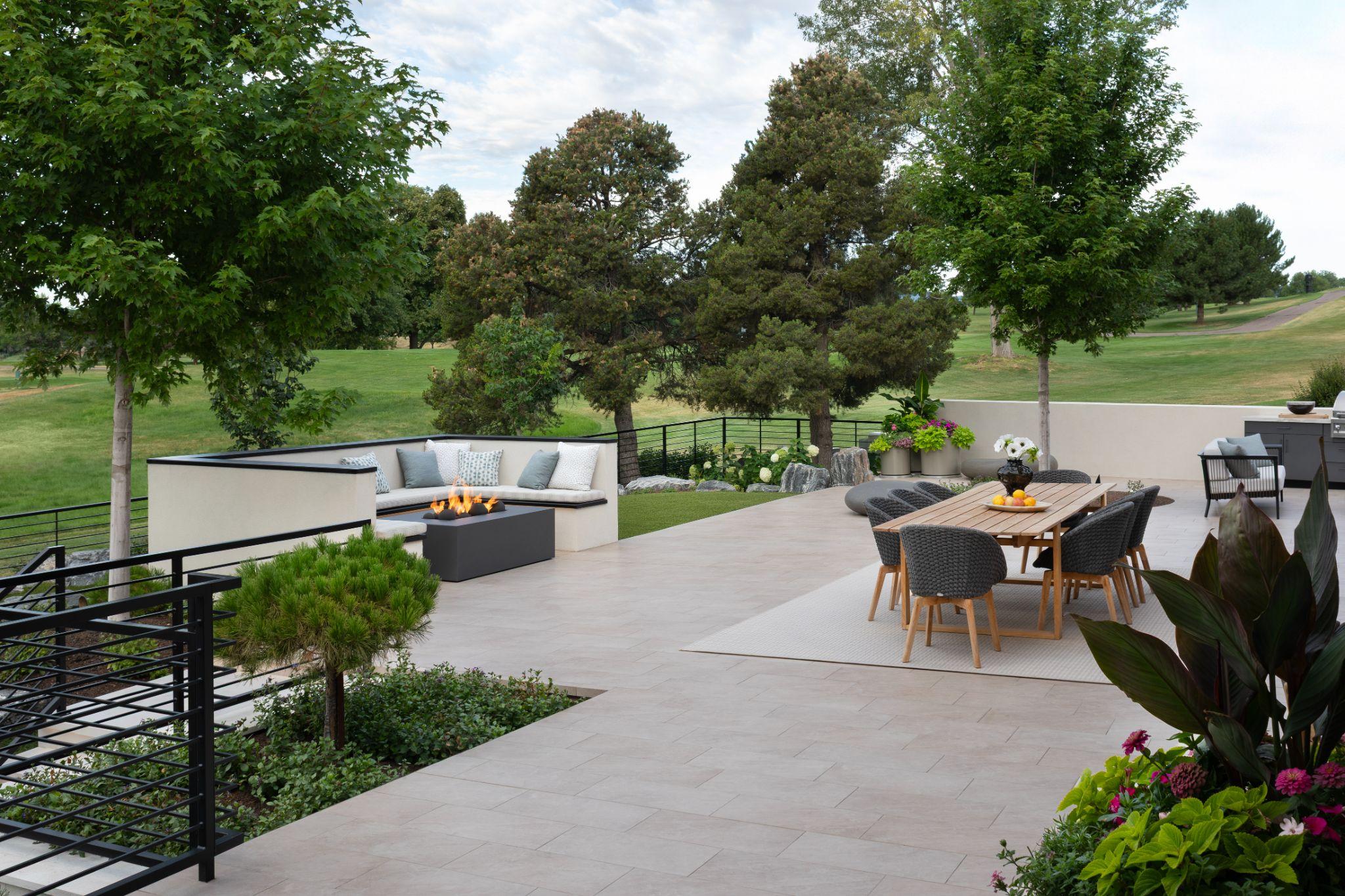 Elevated backyard patio with fire feature and dining space