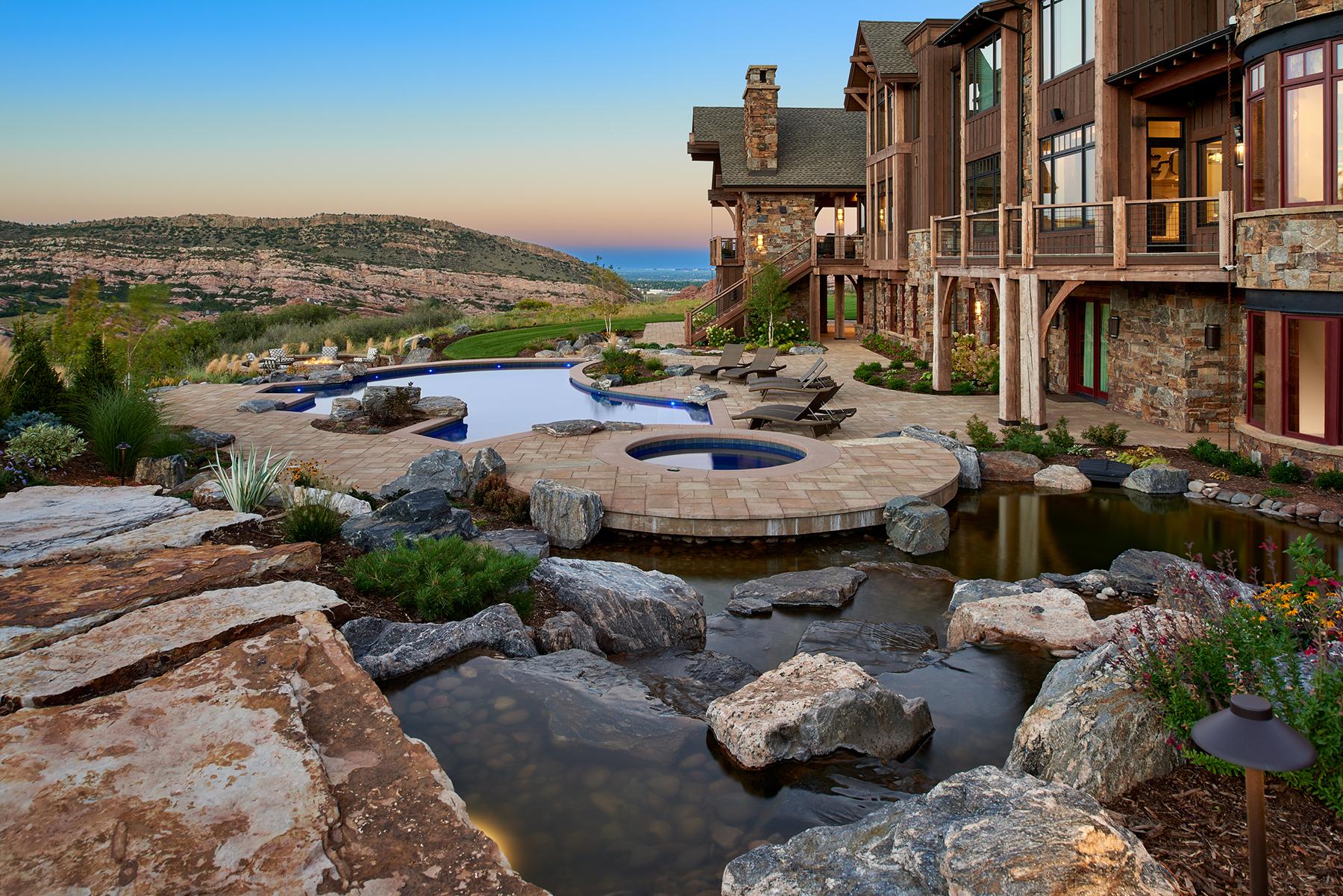 Luxury stone pool patio with mountain views