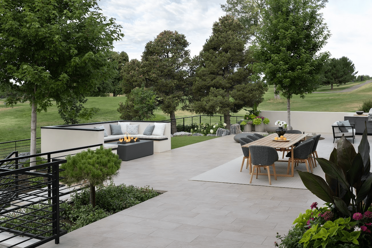 An outdoor living area with a firepit and a table